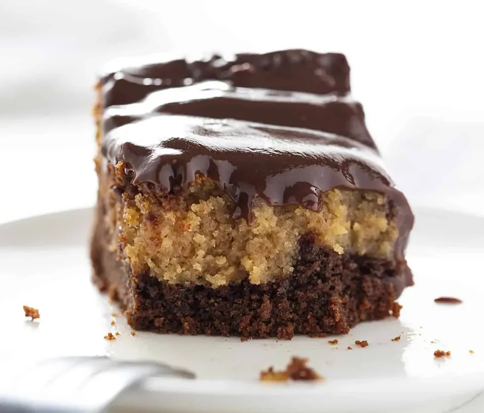 <a href="https://iambaker.net/chocolate-pb-ooey-gooey-cake/" target="_blank" rel="noopener noreferrer"><strong>Get the Chocolate Peanut Butter Ooey Gooey Cake recipe from I Am Baker</strong></a>