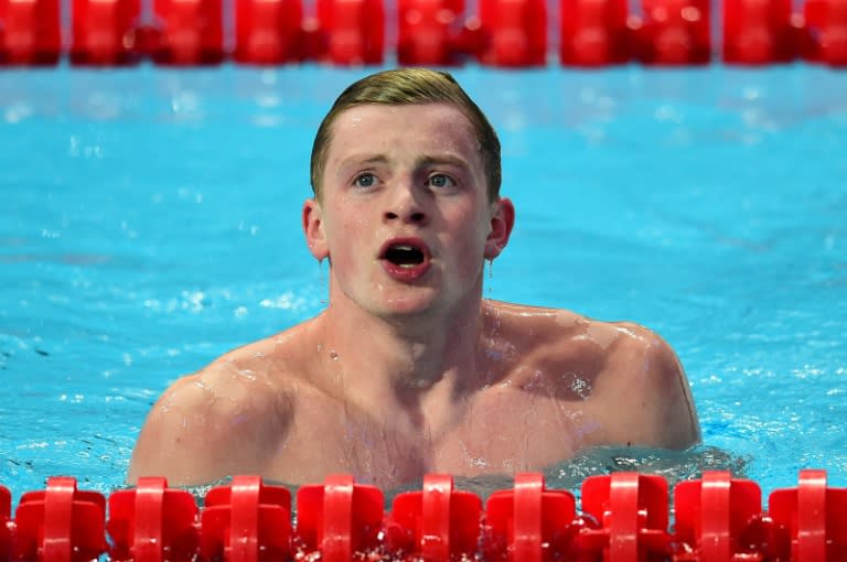 Great Britain's Adam Peaty reacts after winning the men's 100m breaststroke swimming event at the 2015 FINA World Championships in Kazan on August 3, 2015