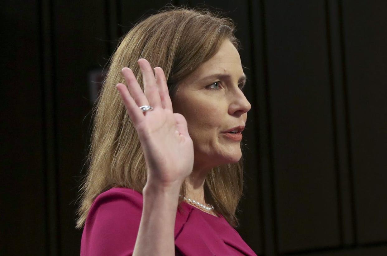 <span class="caption">Supreme Court nominee Amy Coney Barrett is sworn in Oct. 12 for her confirmation hearing before the Senate Judiciary Committee.</span> <span class="attribution"><a class="link " href="https://newsroom.ap.org/detail/APTOPIXSupremeCourtBarrett/84957f0f66364503a02770b7643b1e8f/photo?Query=Amy%20coney%20BArrett&mediaType=photo&sortBy=arrivaldatetime:asc&dateRange=Anytime&totalCount=2982&currentItemNo=18" rel="nofollow noopener" target="_blank" data-ylk="slk:Leah Millis/Pool via AP;elm:context_link;itc:0;sec:content-canvas">Leah Millis/Pool via AP</a></span>