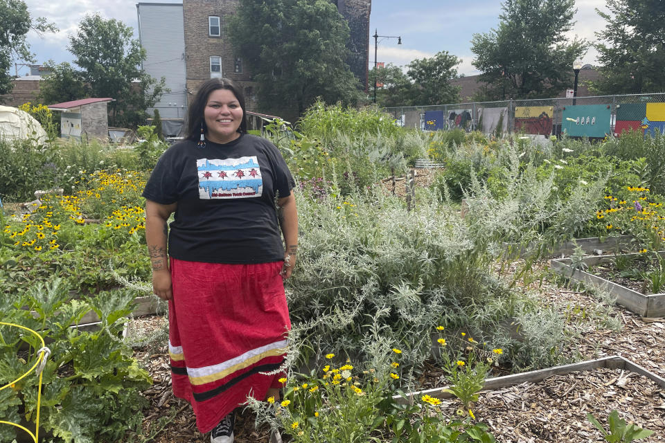 Janie Pochel, an advisor to the Chi-Nations Youth Council, is pictured at the First Nations Garden in Chicago, on Aug. 3, 2022. The garden was established in the spring of 2019 and is host to many traditional Indigenous crops including prairie sage, sweetgrass and strawberries. (Claire Savage/Report for America via AP)