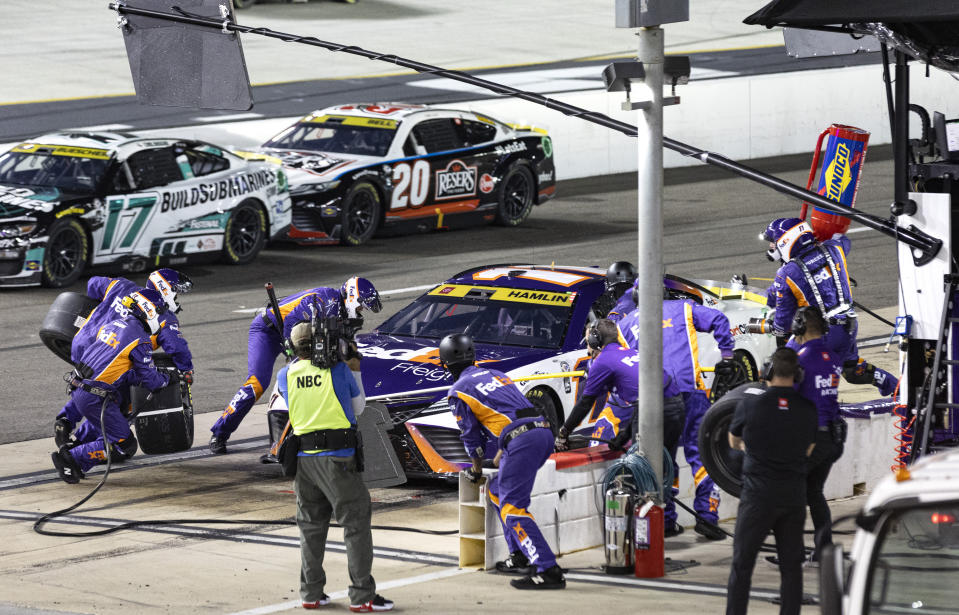 Denny Hamlin makes a pit stop during the NASCAR Cup Series auto race Saturday, Sept. 16, 2023, in Bristol, Tenn. (AP Photo/Wade Payne)