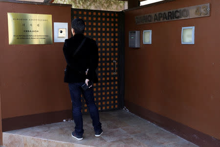 A journalist from South Korea stands outside the North Korea's embassy in Madrid, Spain, February 28, 2019. REUTERS/Sergio Perez