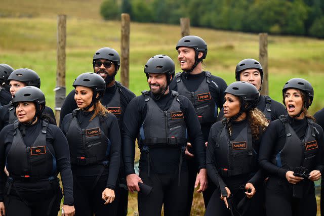 <p>Euan Cherry/PEACOCK</p> Johnny 'Bananas' Devenanzio (center) competing on 'The Traitors' season 2.