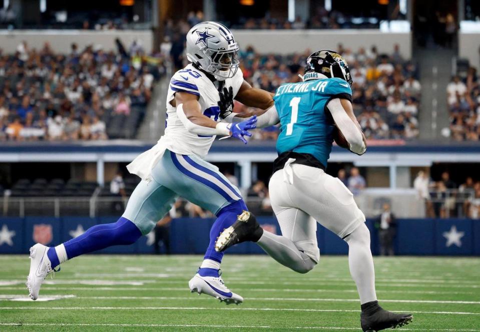 Dallas Cowboys linebacker Damone Clark prepares to tackle Jacksonville Jaguars running back Travis Etienne Jr. on Saturday, August 12, 2023, at AT&T Stadium in Arlington. Amanda McCoy/amccoy@star-telegram.com