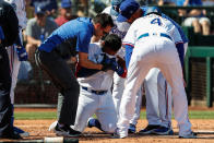 SURPRISE, AZ - MARCH 08: Texas Rangers left fielder Willie Calhoun (5) grabs his face after he's hit by a pitch during the spring training MLB baseball game between the Los Angeles Dodgers and the Texas Rangers on March 8, 2020 at Surprise Stadium in Surprise, Arizona. (Photo by Kevin Abele/Icon Sportswire via Getty Images)