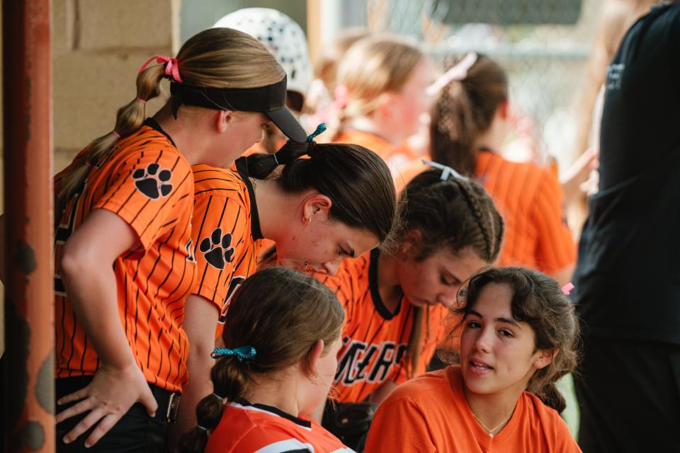 Strasburg converses in their dugout during a game against Buckeye Trail, Tuesday, April 30 at Strasburg-Franklin Park, in Strasburg.