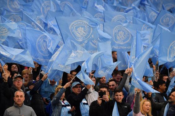Manchester City fans at a Champions League game (AFP/Getty Images)