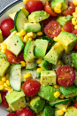 <p>Don't confuse this with guac—there's way more depth of flavour, which makes it one of our favourite summer sides of all time. But the real beauty? You're totally welcome to eat it with tortilla crisps. (Just know it tastes amazing without 'em.)</p><p>Get the <a href="https://www.delish.com/uk/cooking/recipes/a29842914/avocado-tomato-salad-recipe/" rel="nofollow noopener" target="_blank" data-ylk="slk:Avocado & Tomato Salad;elm:context_link;itc:0;sec:content-canvas" class="link ">Avocado & Tomato Salad</a> recipe.</p>