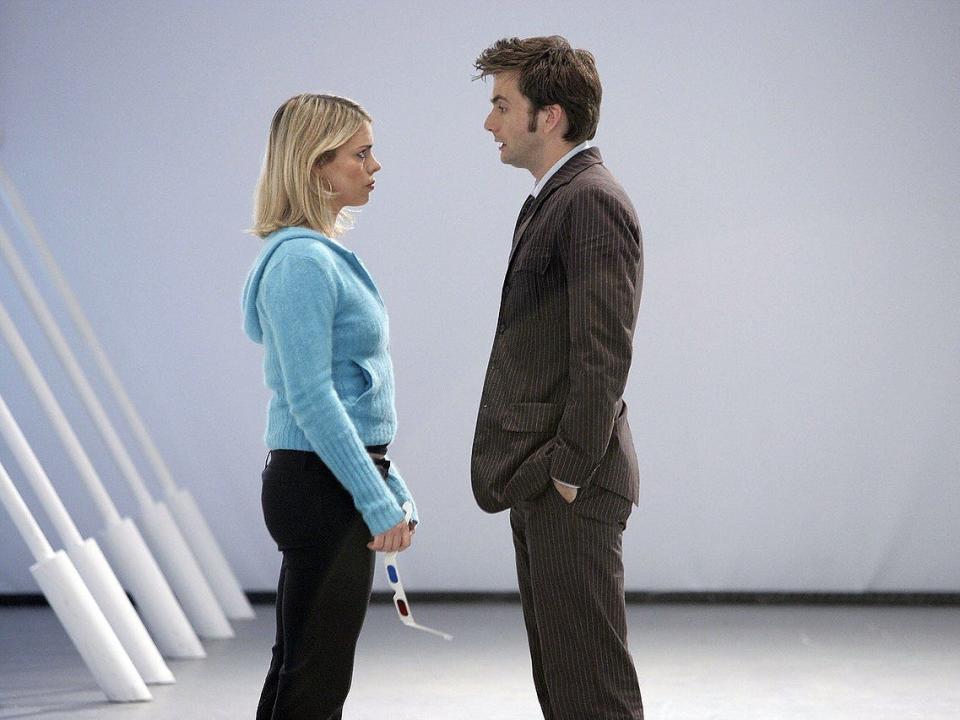 Billie Piper in blue sweater and David Tennant in brown suit in "Doctor Who."