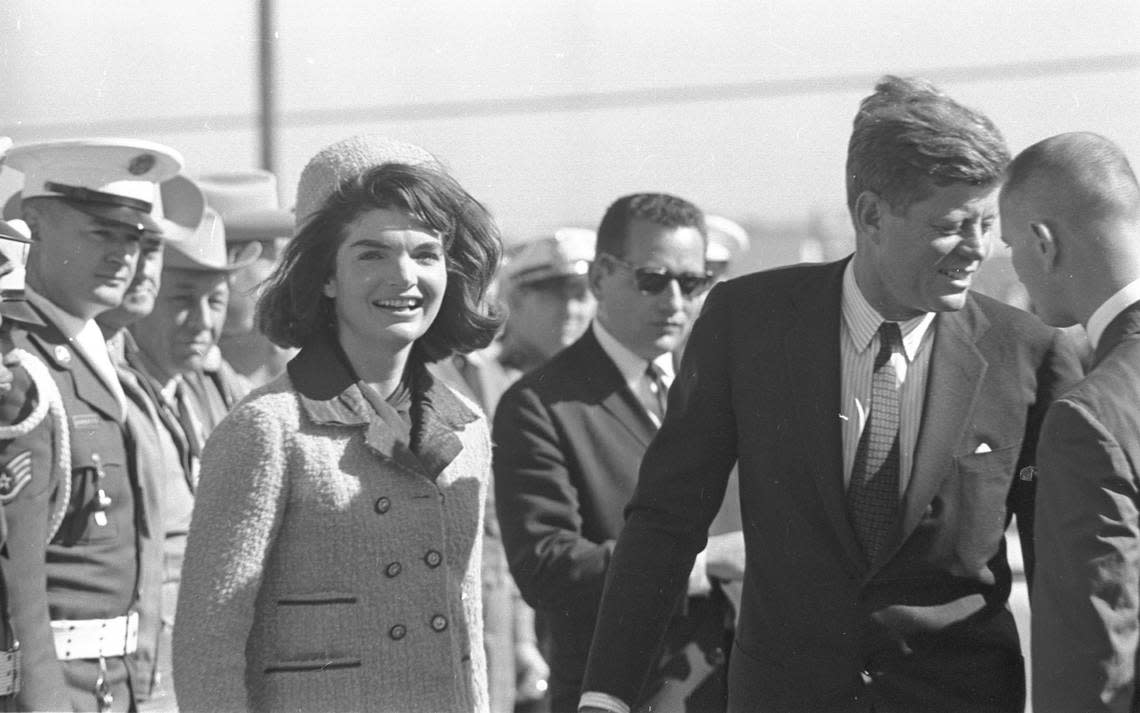 President John F. Kennedy and wife Jackie followed by bodyguard Clint Hill as they leave Carswell AFB for Dallas, 11/22/1963