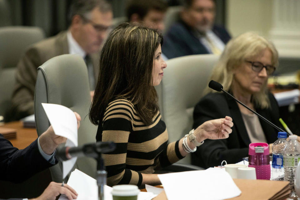 Kim Westbrook Strach, executive director of the Bipartisan State Board of Elections & Ethics Enforcement, questions Mark Harris during the fourth day of a public evidentiary hearing on the 9th congressional district voting irregularities investigation Thursday, Feb. 21, 2019, at the North Carolina State Bar in Raleigh, N.C. (Travis Long/The News & Observer via AP, Pool)