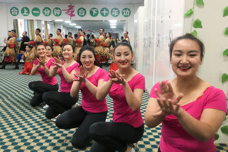 FILE PHOTO: Residents perform for reporters and government officials during a government organised visit to the Hotan county vocational educational training centre in Hotan county, Xinjiang Uighur Autonomous Region, China, January 5, 2019. REUTERS/Ben Blanchard/File Photo