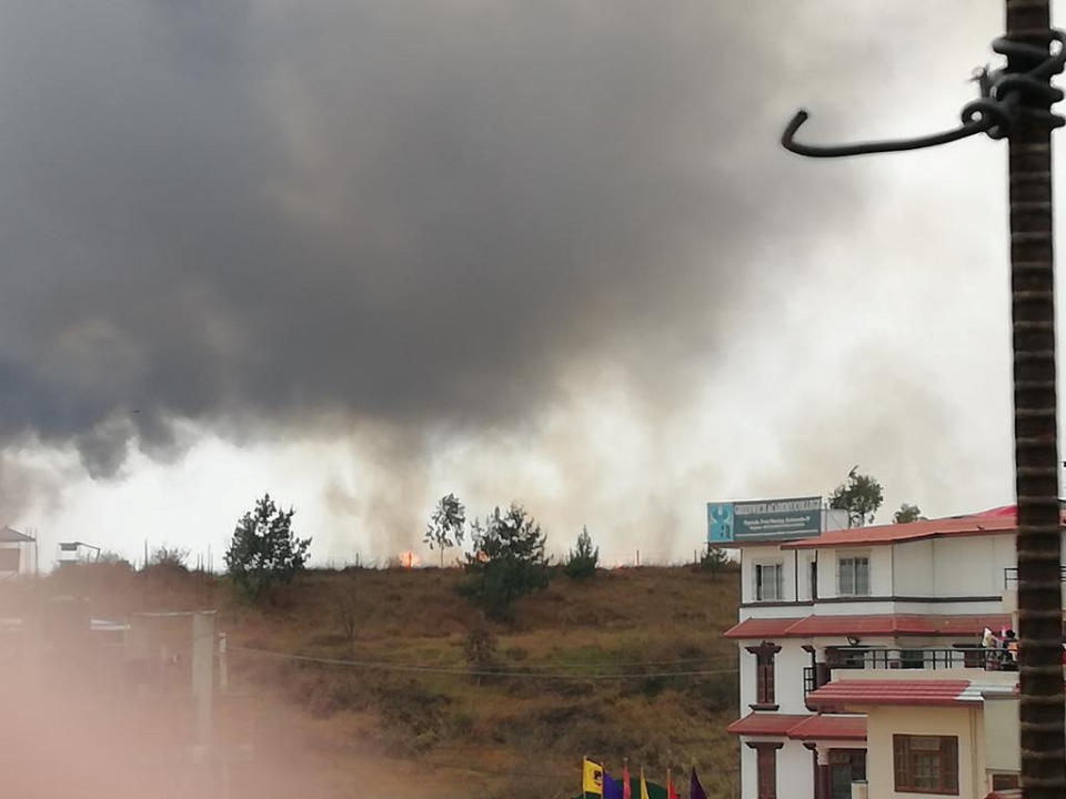 <p>Smoke rises following the crash of a Bangladeshi aircraft at Kathmandu airport, Nepal March 12, 2018, in this picture obtained from social media. (Photo: Rusha Giri/Via Reuters) </p>