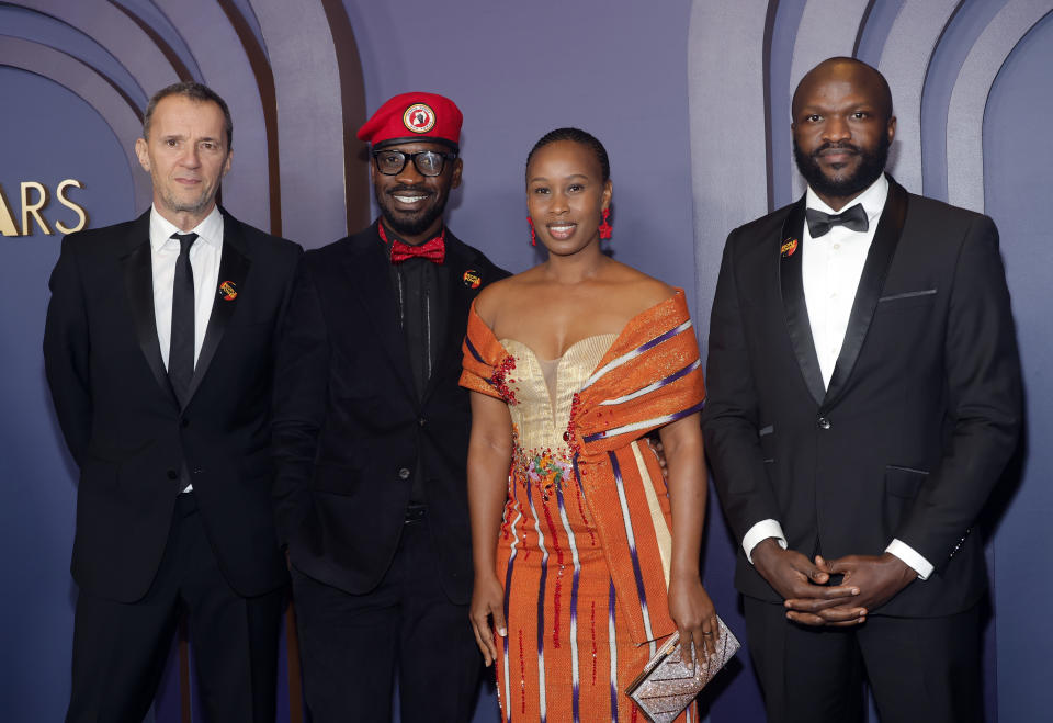 (L-R) John Battsek, Bobi Wine, Barbie Kyagulanyi (Bobi's wife), and Moses Bwayo attend the Motion Picture Academy's 14th Annual Governors Awards.