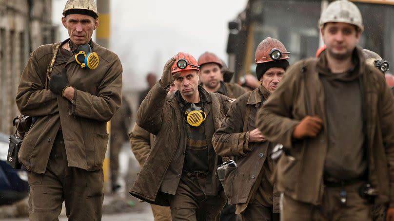 Ukrainian coal miners arrive at the Zasyadko mine, to assist in the search for bodies of colleagues following an explosion, in Donetsk, Ukraine, Wednesday, March 4, 2015.
