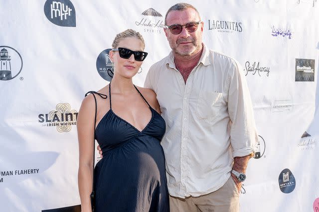 <p>Roy Rochlin/Getty Images</p> Taylor Neisen and Liev Schreiber at the Montauk Point Lighthouse on July 13, 2023, in Montauk, New York