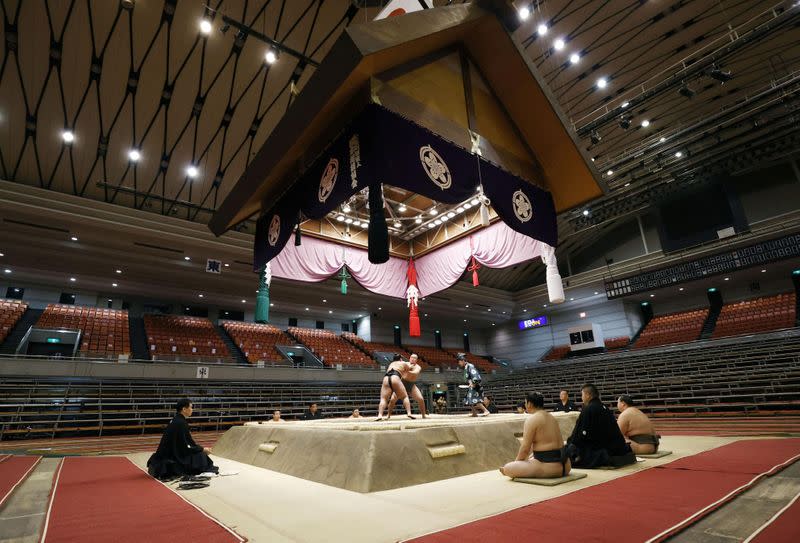 Spectator's seats are seen empty during a match of the Spring Grand Sumo Tournament which is taking behind closed doors amid the spread of the new coronavirus, in Osaka, western Japan