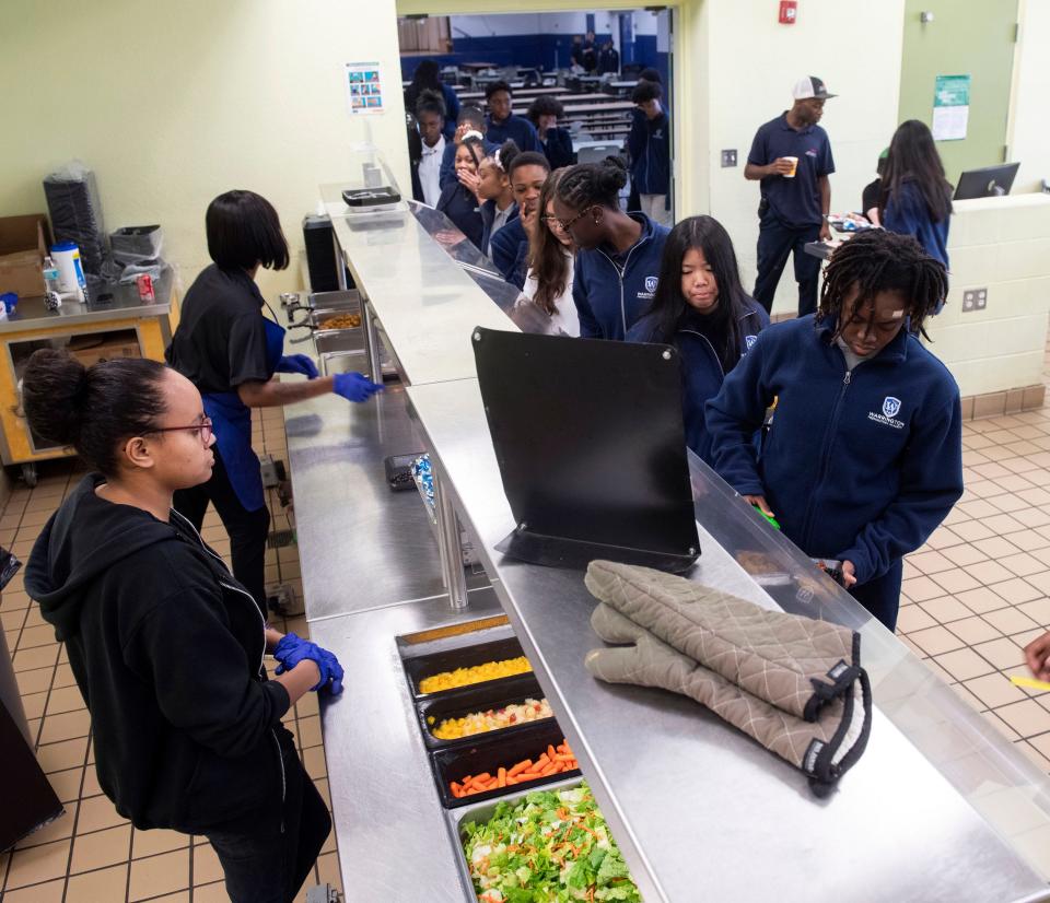Students select from various nutritional food options available to them during lunch at the Warrington Preparatory Academy on Tuesday, Oct. 24, 2023.