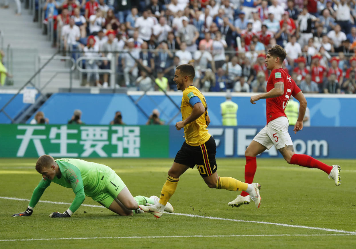 Belgium’s Eden Hazard watches his late shot hit the net, to seal a 2-0 victory for Belgium over England
