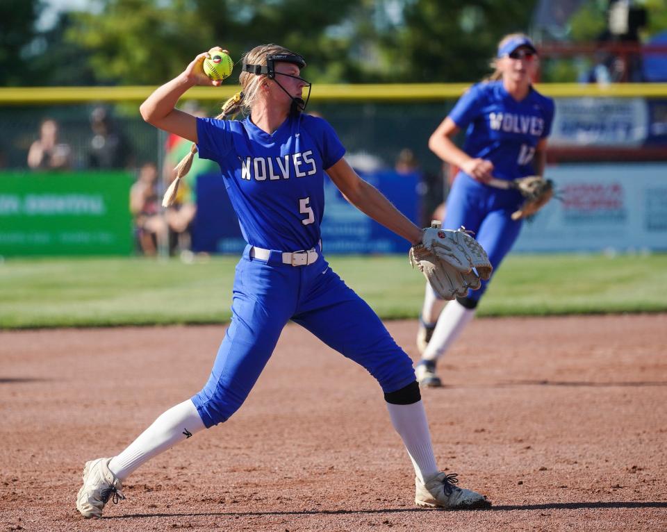 Waukee Northwest's Kiana Carnes (5) throws out a Fort Dodge runner at first base on Thursday during the Class 5A softball state championship at Harlan Rogers Sports Complex in Fort Dodge.