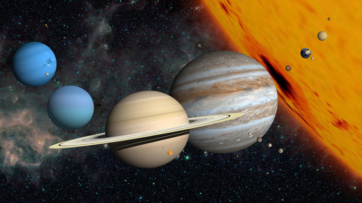  The planets and larger moons to scale with the Sun. 