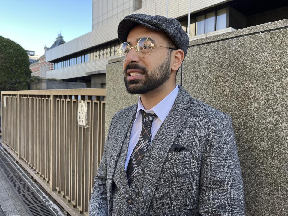 Syed Zain, 26, a Japanese citizen of Pakistani descent, speaks in front of the Tokyo District Courthouse in Tokyo Monday, Jan. 29, 2024. Zain is one of the plaintiffs who have filed a lawsuit demanding a stop to “racial profiling” in Japan.(AP Photo/Yuri Kageyama)