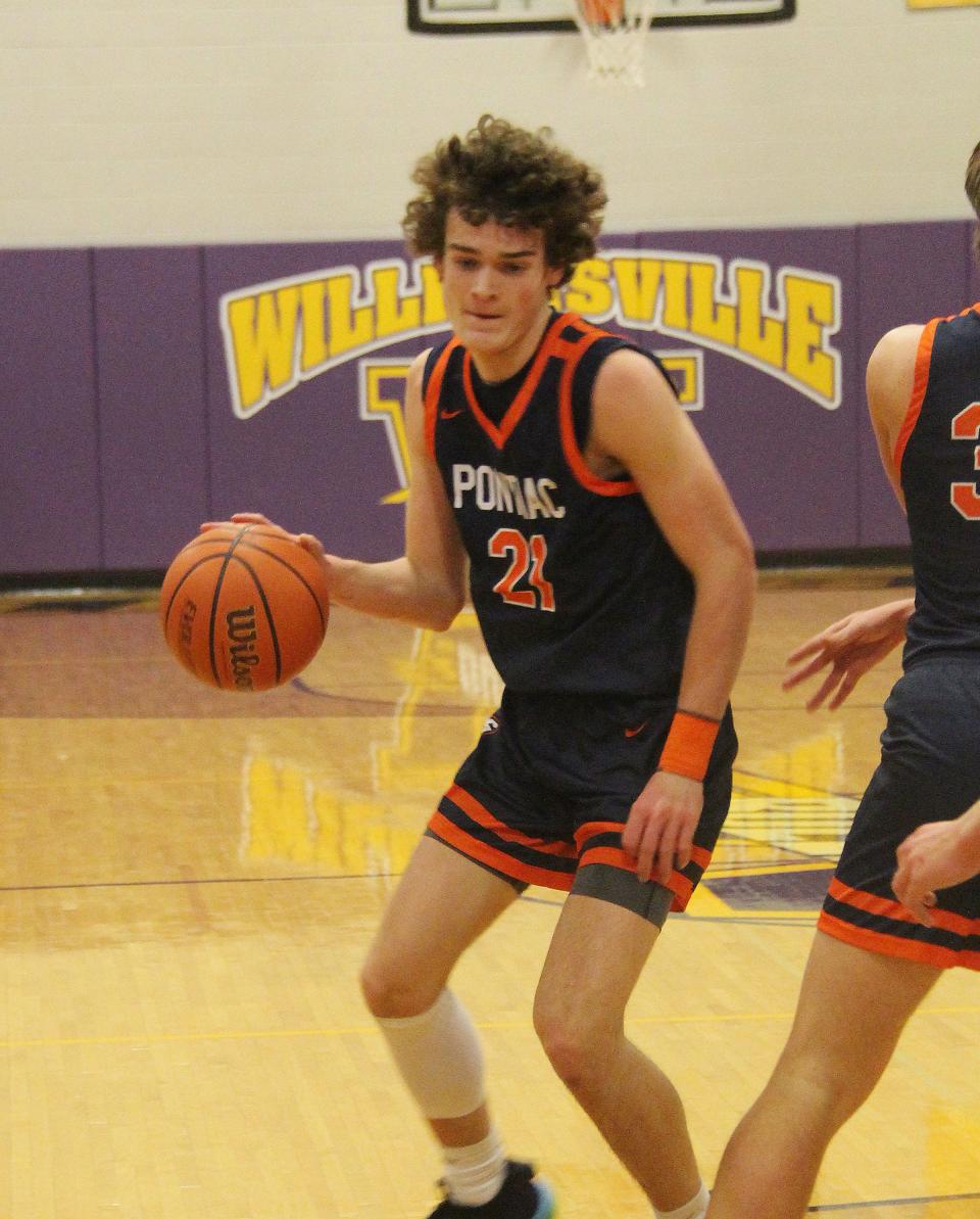 Pontiac's Riley Weber runs off a pick as he looks to get to the basket Saturday against New Berlin.