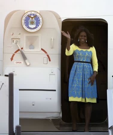 U.S. first lady Michelle Obama arrives at Stansted Airport, southern England June 15, 2015. REUTERS/Neil Hall