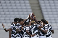 Fiji players huddle up at the start of their women's rugby sevens semifinal match against New Zealand at the 2020 Summer Olympics, Saturday, July 31, 2021 in Tokyo, Japan. (AP Photo/Shuji Kajiyama)