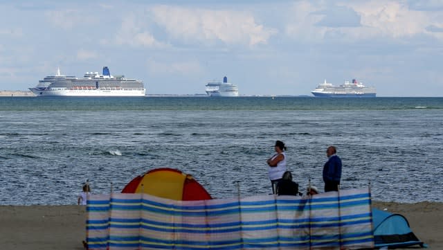 A view of the cruise ships from Studland beach (Steve Parsons/PA)