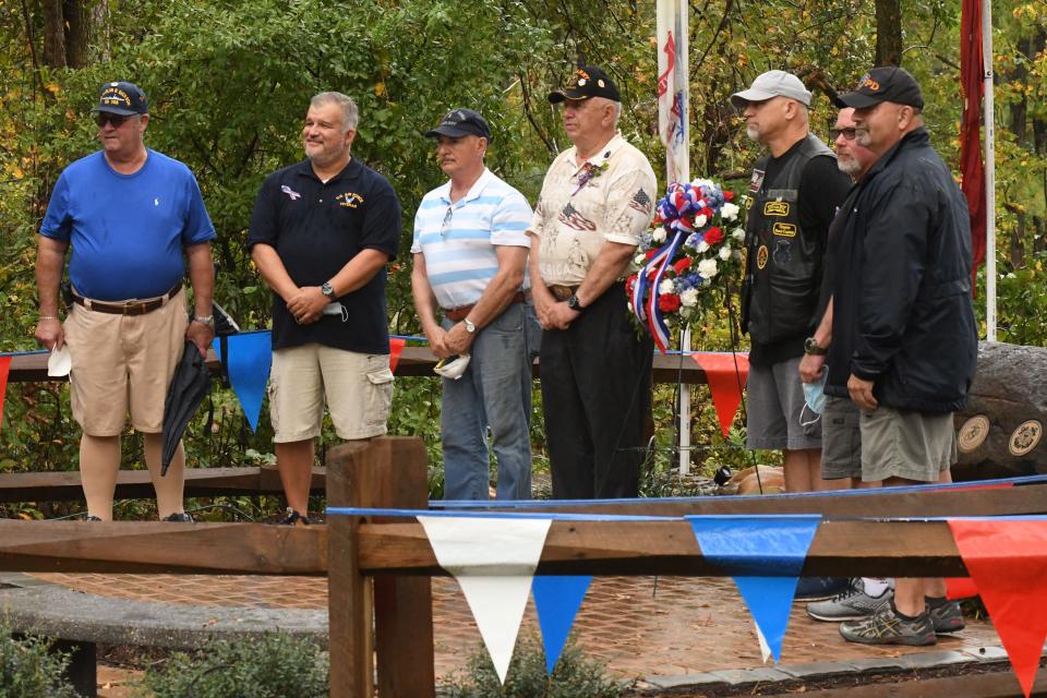 Belville Mayor Mike Allen and other Veterans place a wreath at the Town of Belville Veterans Day Ceremony in 2020 at the Brunswick Riverwalk Veterans Memorial.