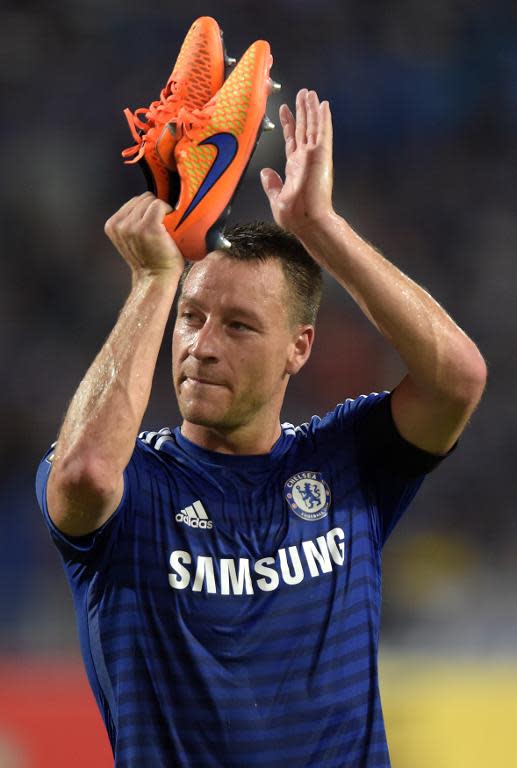 Chelsea's John Terry gestures to fans after the friendly match against Thailand All-Stars in Bangkok on May 30, 2015