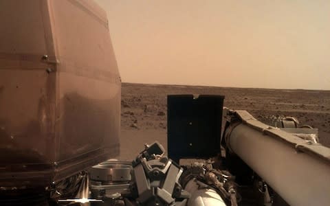 A view from NASA's InSight lander after it touched down on the surface of Mars - Credit: AFP