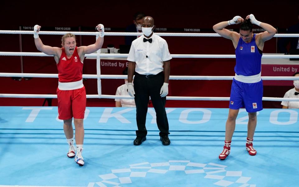 Britain's Lauren Price, left, and Nouchka Fontlijn, of the Netherlands, react after their women's middleweight 75-kg boxing match at the 2020 Summer Olympics -  AP