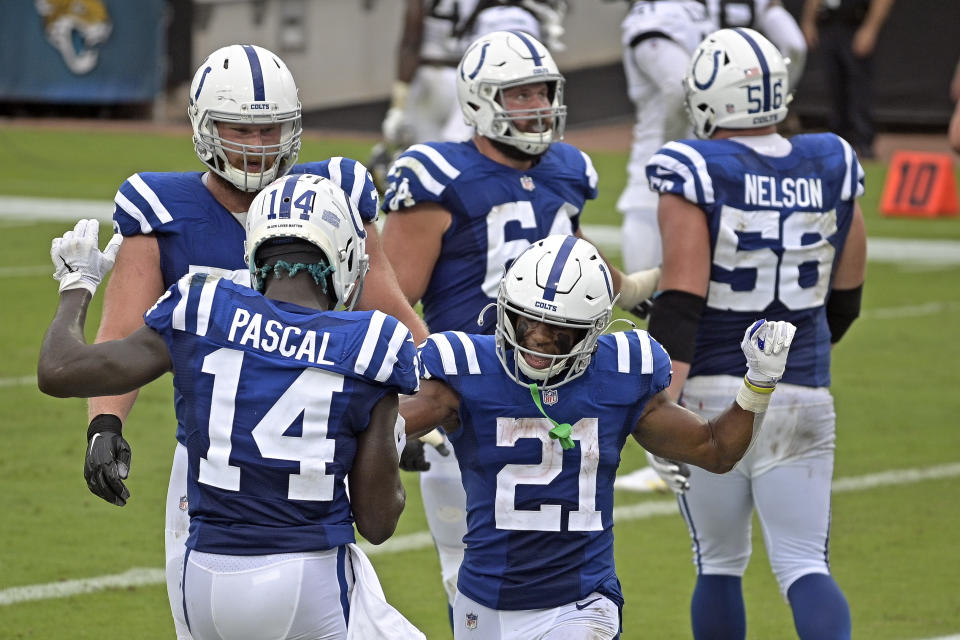 Indianapolis Colts running back Nyheim Hines (21) celebrates his touchdown against the Jacksonville Jaguars with teammate wide receiver Zach Pascal (14) during the first half of an NFL football game, Sunday, Sept. 13, 2020, in Jacksonville, Fla. (AP Photo/Phelan M. Ebenhack)