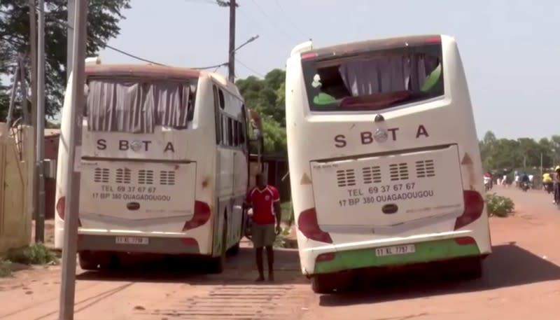 Busses are seen after they were attacked near Fada N'gourma