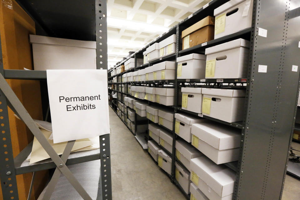 In this Oct. 11, 2013 photograph, items that will eventually be displayed in one of the two planned museums to be built in Jackson, Miss., line the shelves at the state Department of Archives and History. Officials say they did not set out to have separate-but-equal museums for the documentation of the state's history, but it could end up that way. Groundbreaking is set for Thursday, Oct. 24, 2013, for the Mississippi History Museum and the Mississippi Civil Rights Museum, side-by-side buildings, that when opened in 2017, may together tell the state's complex history. (AP Photo/Rogelio V. Solis)