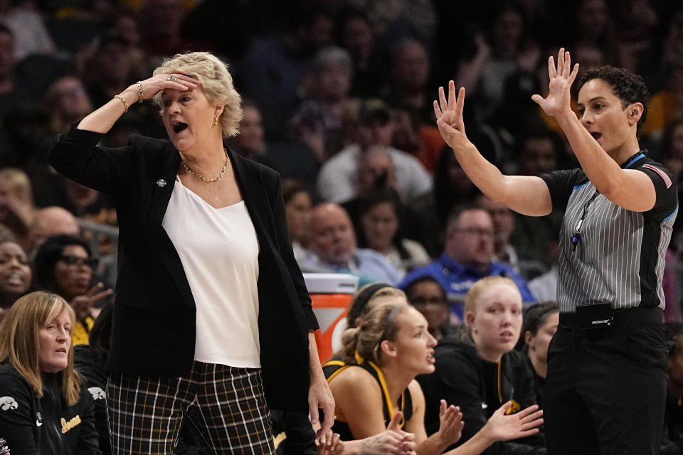 Iowa head coach Lisa Bluder reacts during the first half of an NCAA women's college basketball game against Virginia Tech Thursday, Nov. 9, 2023, in Charlotte, N.C. (AP Photo/Chris Carlson)