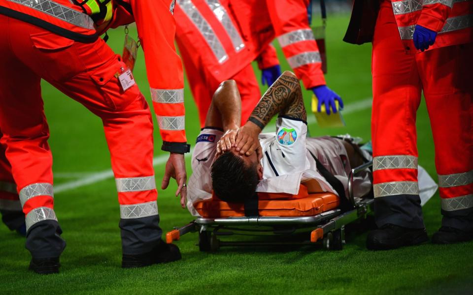 Leonardo Spinazzola of Italy is stretchered off the pitch - Shutterstock