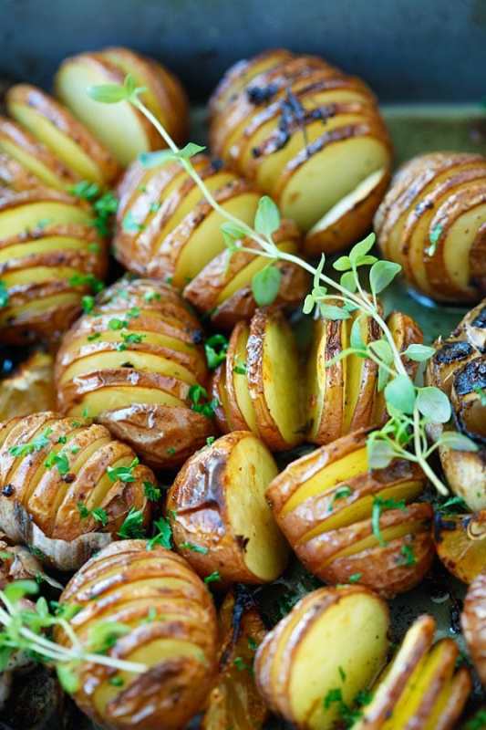 <p>Rasa Malaysia</p><p>Garlic herb Hasselback potatoes—baked potatoes filled with garlic, herb, olive oil, butter and lemon (AKA the best homemade roasted potatoes recipe ever!).</p><p><strong>Get the recipe: <a href="https://rasamalaysia.com/garlic-herb-roasted-potatoes/" rel="nofollow noopener" target="_blank" data-ylk="slk:Garlic Herb Roasted Potatoes;elm:context_link;itc:0;sec:content-canvas" class="link ">Garlic Herb Roasted Potatoes</a></strong></p>