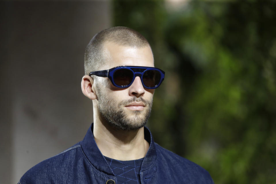 A model wears a creation as part of the Armani men's Spring-Summer 2020 collection, unveiled during the fashion week, in Milan, Italy, Monday, June 17, 2019. (AP Photo/Luca Bruno)