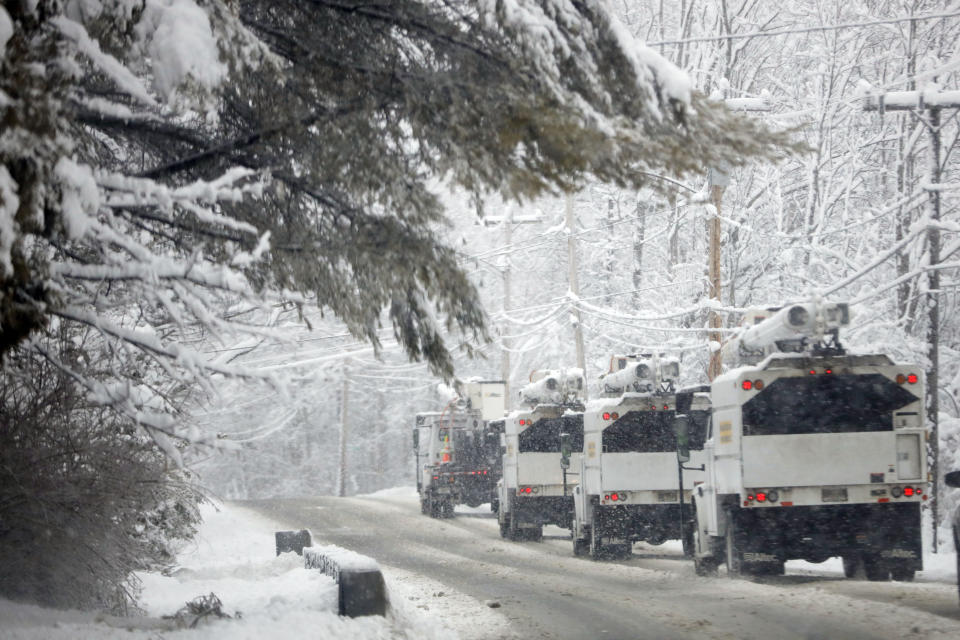 Teams of line crews are seen around the Berkshires, at the ready to attend to the many downed power lines and trees during Tuesday's nor'easter, which caused widespread damage and power outages. Tuesday, March 14, 2023. (Stephanie Zollshan/The Berkshire Eagle via AP)