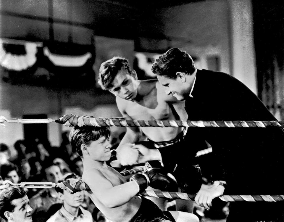 FILE - This file image shows Mickey Rooney, left, Spencer Tracy, right, and Frankie Thomas in a scene from the 1938 film "Boys Town." Rooney, a Hollywood legend whose career spanned more than 80 years, died Sunday, April 6, 2014, at his North Hollywood, Calif. home. He was 93. (AP Photo/File)