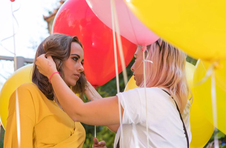 Stephanie has a hair check on set