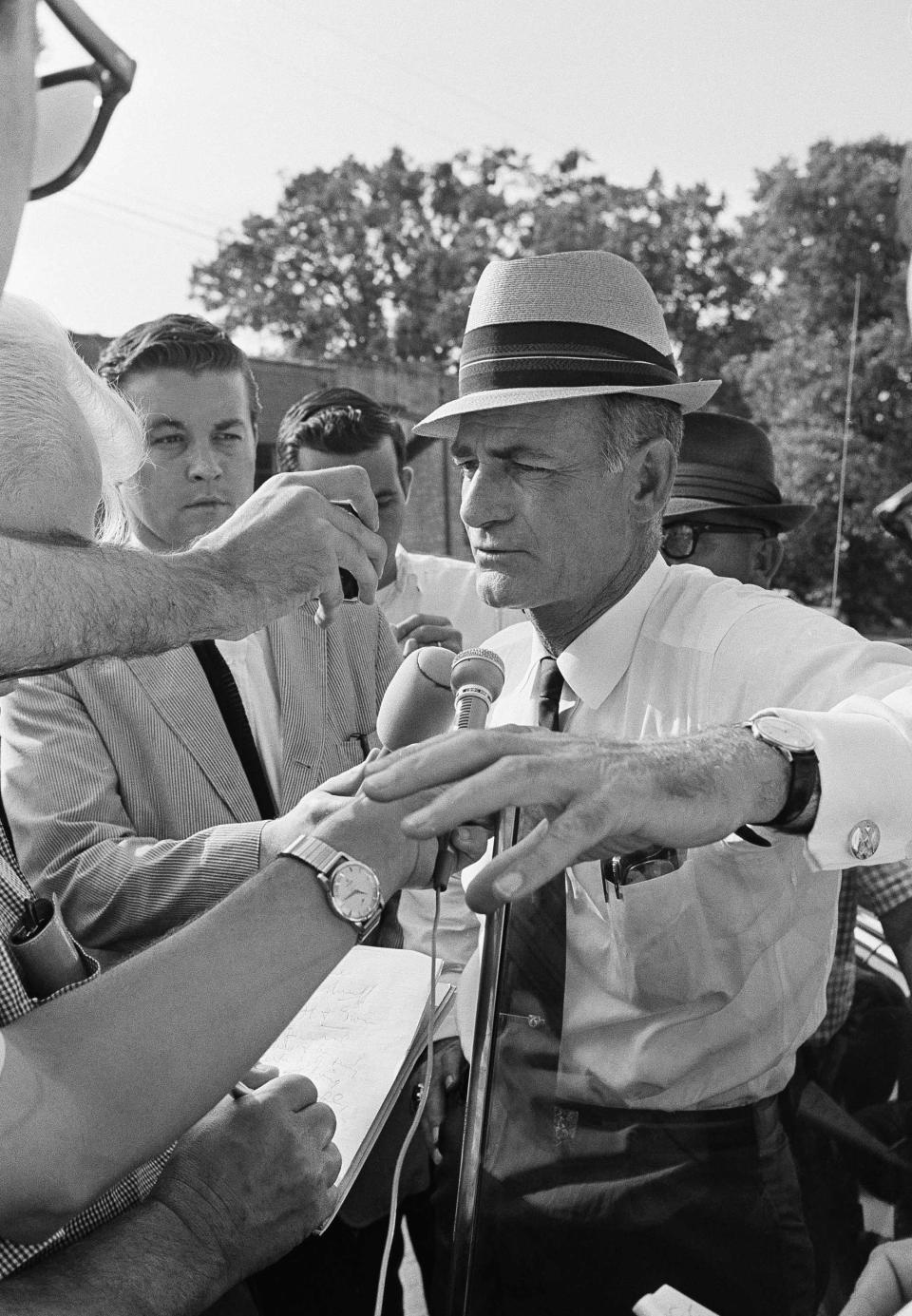 <p>Miss. Gov. Paul Johnson faces reporters in Philadelphia, Miss., on Friday, afternoon, June 27, 1964 after his arrival. He was in town to receive a briefing on search progress for three missing integrationists whose burned out station wagon was discovered Tuesday near Philadelphia. Gov. Johnson later visited the spot where the burned vehicle was found. A search is still underway for the missing trio. (Photo: JAB/AP) </p>