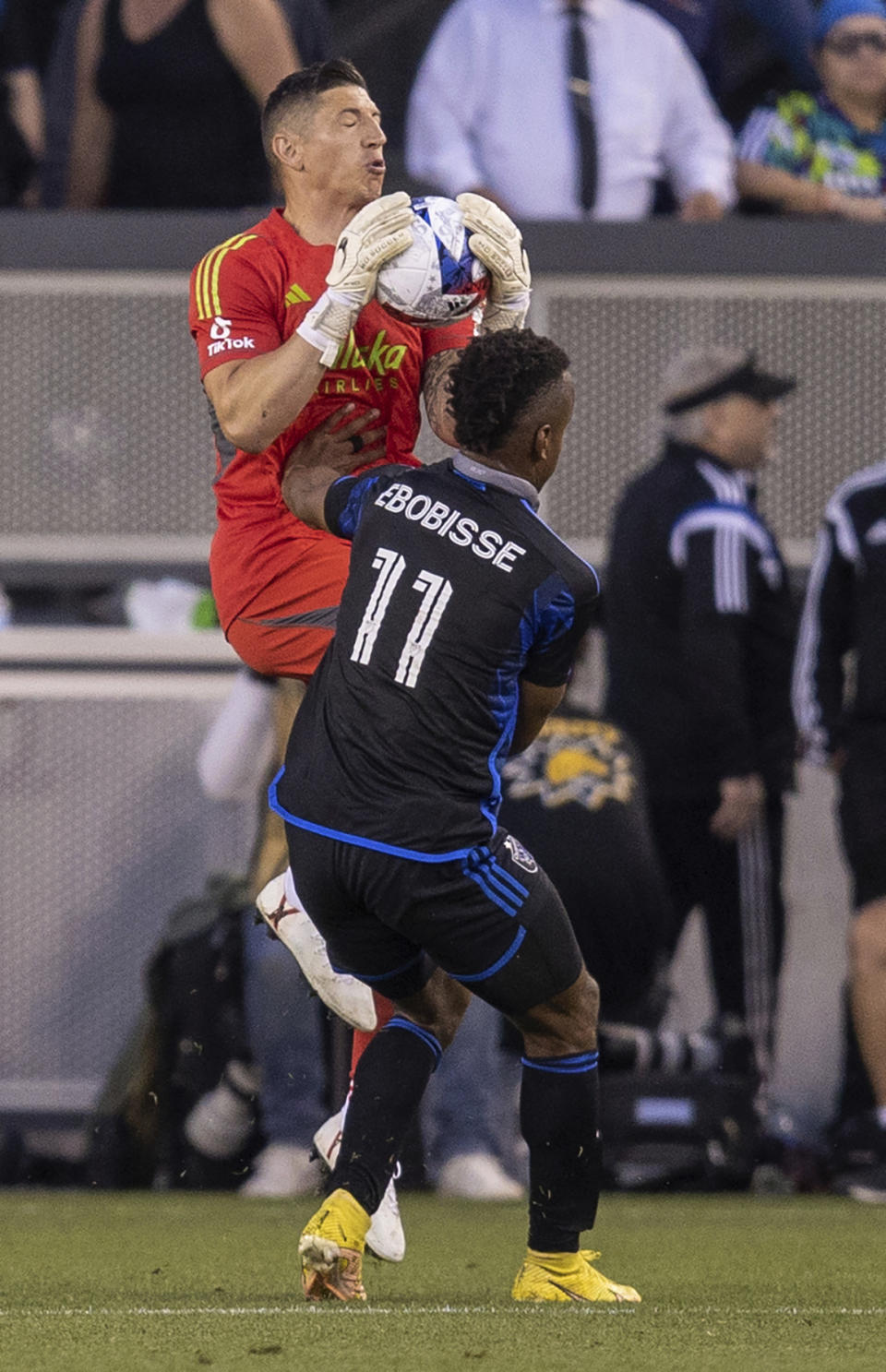 Portland Timbers goalkeeper David Bingham stops a play by San Jose Earthquakes forward Jeremy Ebobisse (11) during the first half of an MLS soccer match in San Jose, Calif., Saturday, June 17, 2023. (AP Photo/John Hefti)