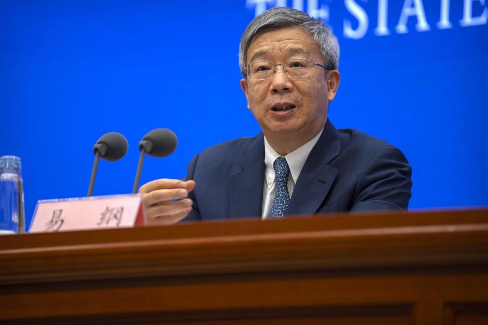 FILE - Yi Gang, governor of the People's Bank of China, speaks during a press conference at the State Council Information Office in Beijing, on March 3, 2023. China on Sunday, March 12, reappointed Yi as head of the central bank in an effort to reassure entrepreneurs and financial markets by showing continuity at the top while other economic officials change. (AP Photo/Mark Schiefelbein, File)