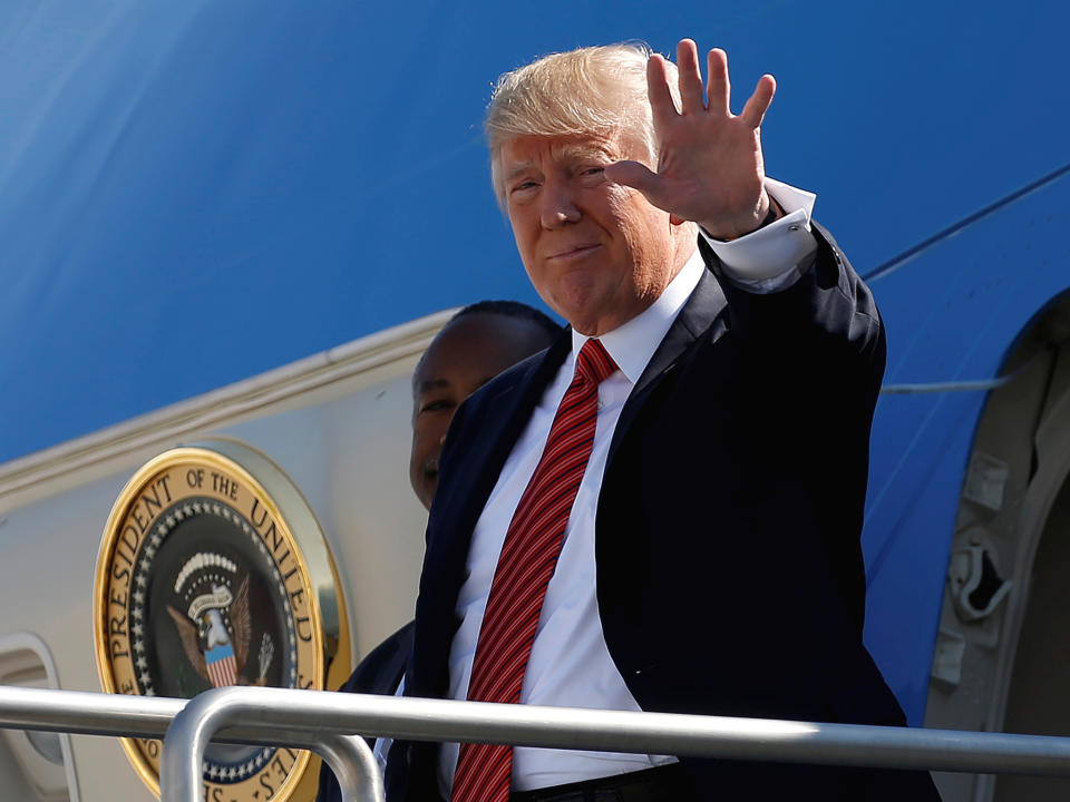 President Donald Trump waves as he steps out from Air Force One in Reno, Nevada: REUTERS