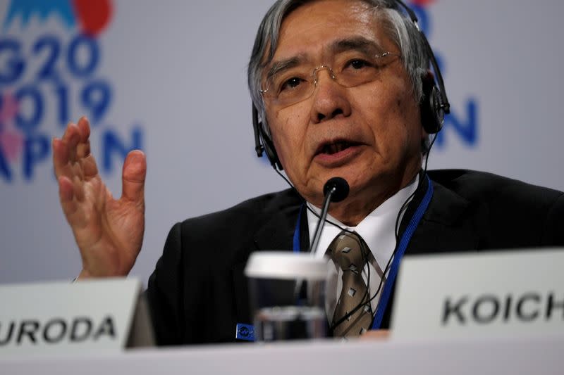 Bank of Japan Governor Haruhiko Kuroda takes questions from reporters at the annual meetings of the International Monetary Fund and World Bank in Washington