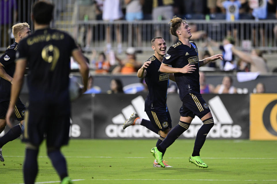 Philadelphia Union's Jack McGlynn, rigth, celebrates after his goal during the first half of an MLS soccer match against the Houston Dynamo, Saturday, July 30, 2022, in Chester, Pa. (AP Photo/Derik Hamilton)